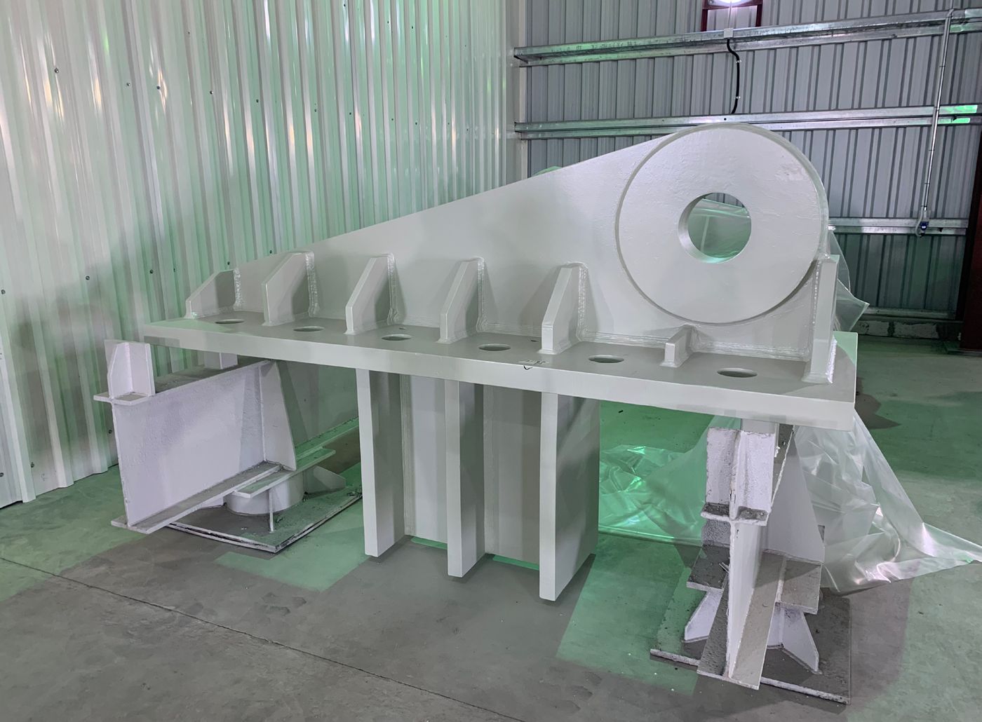 Roof-tie base plate fabrication prior to installation.